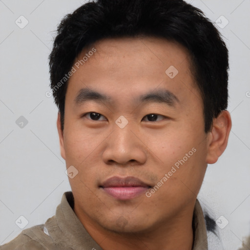 Joyful asian young-adult male with short  black hair and brown eyes