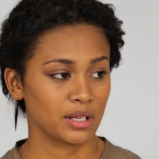 Neutral black young-adult female with short  brown hair and brown eyes
