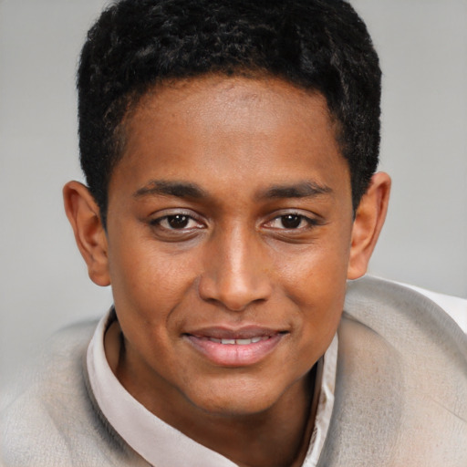 Joyful black young-adult male with short  brown hair and brown eyes