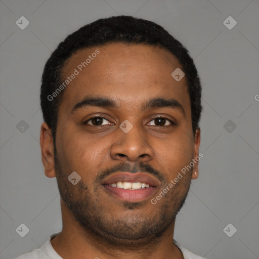 Joyful latino young-adult male with short  brown hair and brown eyes