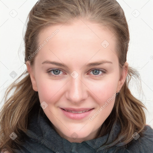 Joyful white young-adult female with long  brown hair and blue eyes