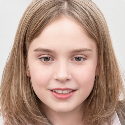 Joyful white child female with long  brown hair and brown eyes