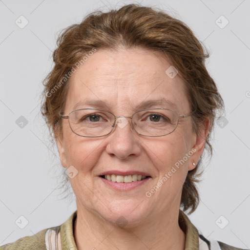 Joyful white middle-aged female with medium  brown hair and blue eyes