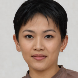 Joyful asian young-adult female with short  black hair and brown eyes