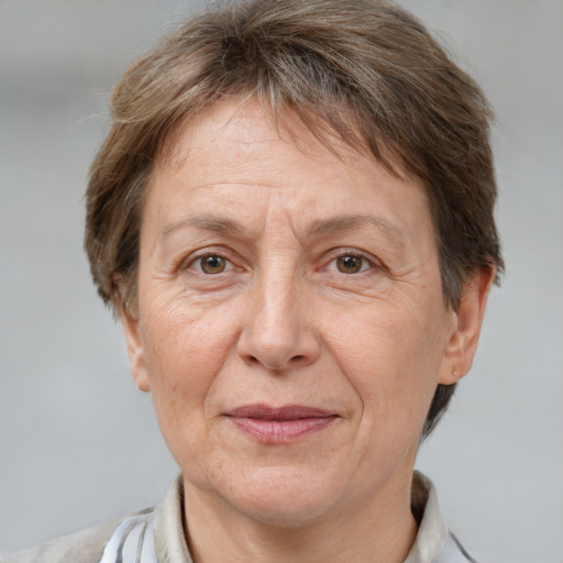 Joyful white middle-aged female with short  brown hair and brown eyes