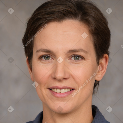 Joyful white adult female with short  brown hair and grey eyes