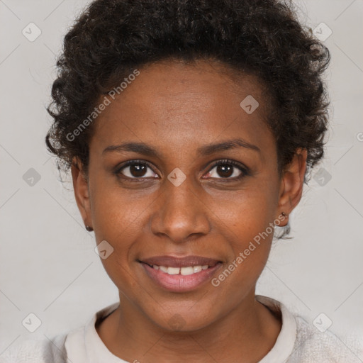 Joyful black young-adult female with short  brown hair and brown eyes