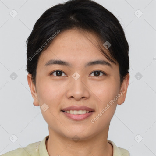 Joyful asian young-adult female with short  brown hair and brown eyes