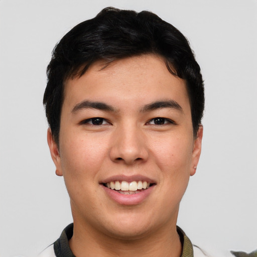 Joyful asian young-adult male with short  brown hair and brown eyes