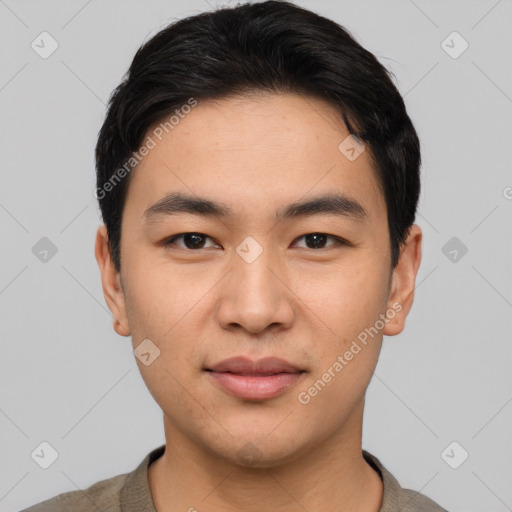 Joyful asian young-adult male with short  black hair and brown eyes