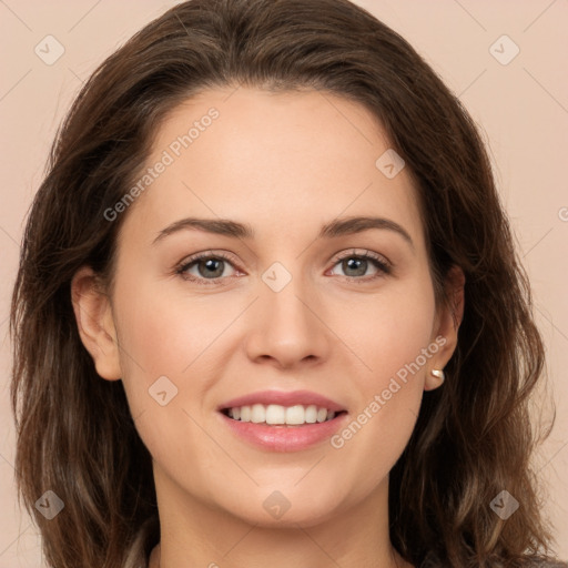 Joyful white young-adult female with long  brown hair and green eyes