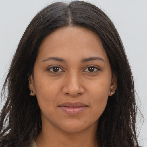 Joyful latino young-adult female with long  brown hair and brown eyes