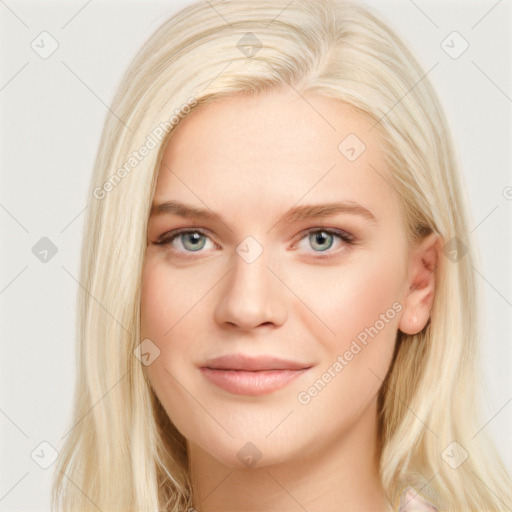 Joyful white young-adult female with long  brown hair and blue eyes