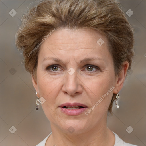 Joyful white adult female with short  brown hair and brown eyes