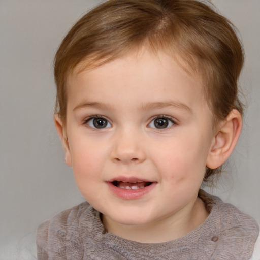 Joyful white child female with short  brown hair and brown eyes