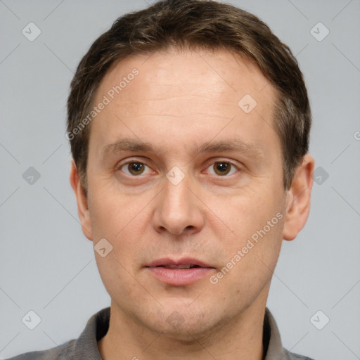 Joyful white adult male with short  brown hair and grey eyes