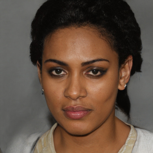 Neutral black young-adult female with short  brown hair and brown eyes