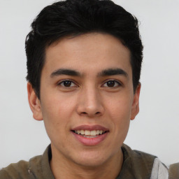 Joyful asian young-adult male with short  brown hair and brown eyes