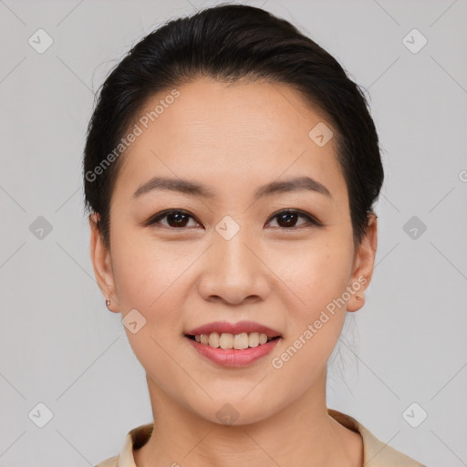 Joyful asian young-adult female with short  brown hair and brown eyes