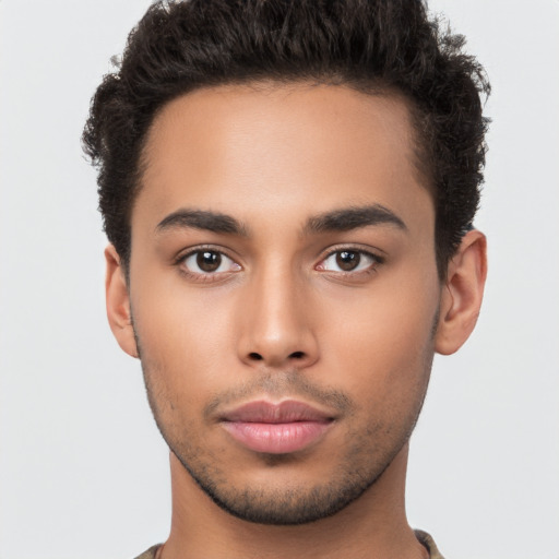 Neutral latino young-adult male with short  brown hair and brown eyes