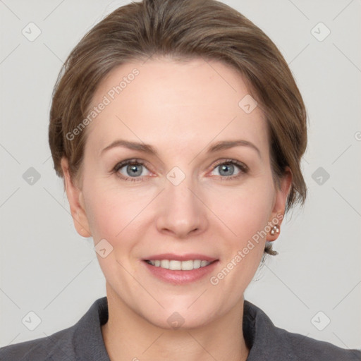 Joyful white adult female with short  brown hair and grey eyes