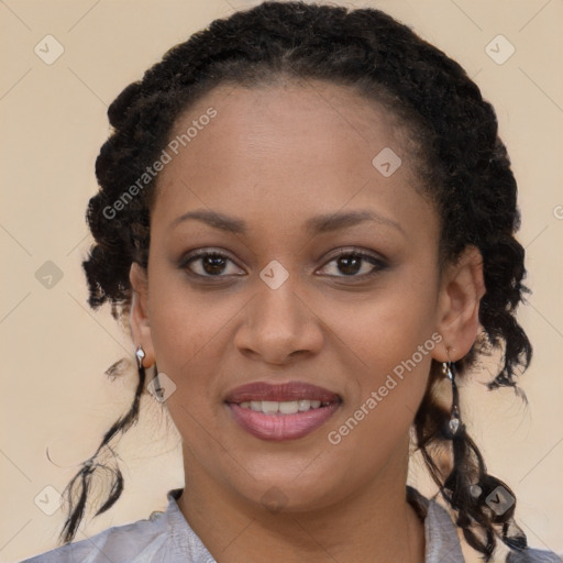 Joyful black young-adult female with long  brown hair and brown eyes