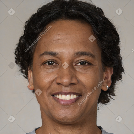 Joyful black adult male with short  brown hair and brown eyes