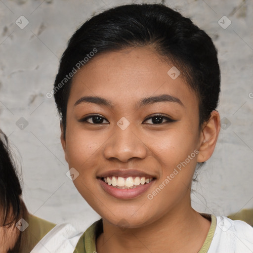 Joyful asian young-adult female with short  brown hair and brown eyes