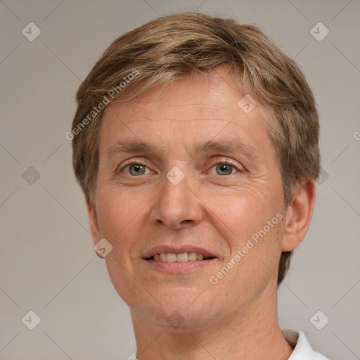 Joyful white adult male with short  brown hair and grey eyes