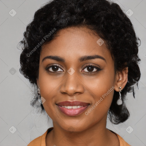 Joyful black young-adult female with long  black hair and brown eyes