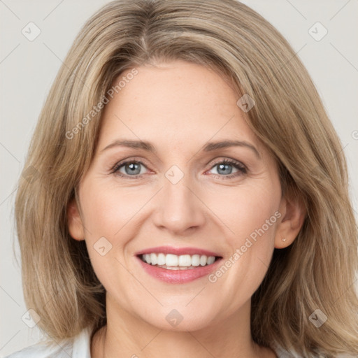 Joyful white young-adult female with medium  brown hair and green eyes