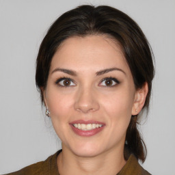 Joyful white young-adult female with medium  brown hair and brown eyes