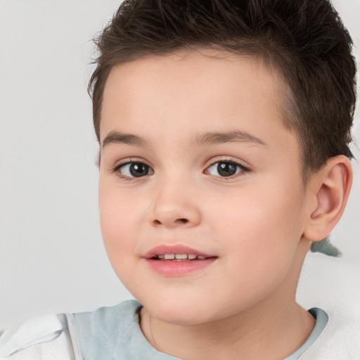 Joyful white child female with short  brown hair and brown eyes