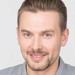 Joyful white adult male with short  brown hair and brown eyes