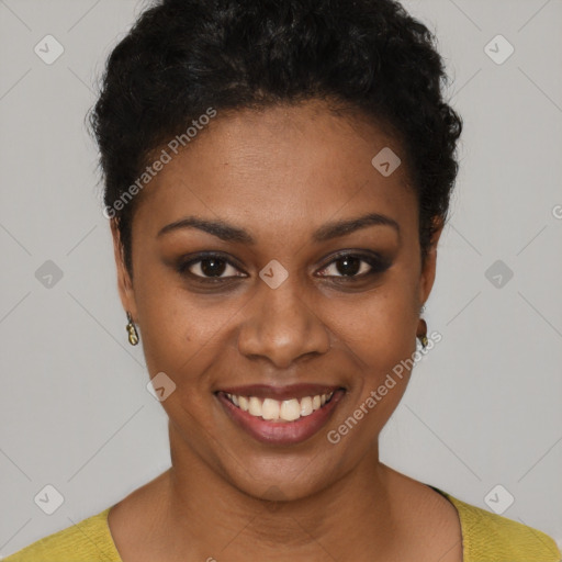 Joyful black young-adult female with short  black hair and brown eyes