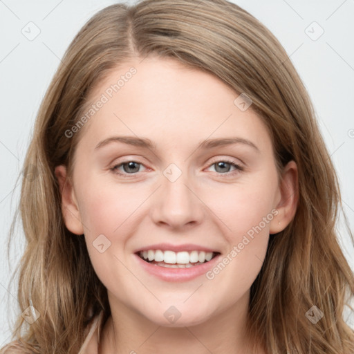 Joyful white young-adult female with long  brown hair and grey eyes