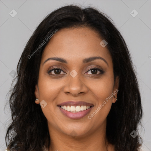 Joyful latino young-adult female with long  brown hair and brown eyes