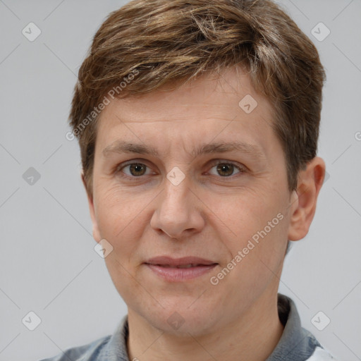 Joyful white adult male with short  brown hair and grey eyes