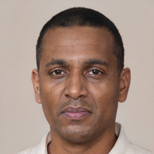 Neutral black adult male with short  black hair and brown eyes