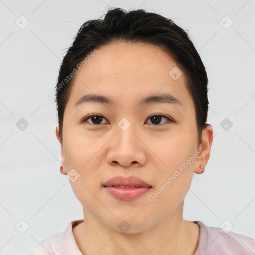 Joyful asian young-adult female with short  brown hair and brown eyes