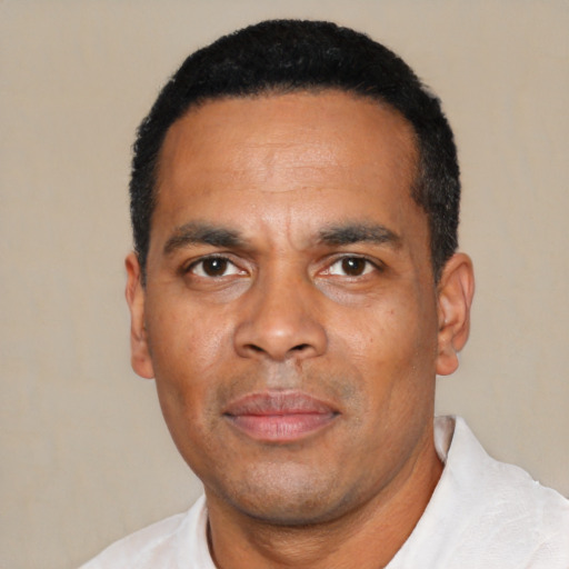 Neutral latino adult male with short  black hair and brown eyes