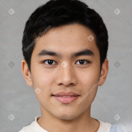 Joyful asian young-adult male with short  black hair and brown eyes