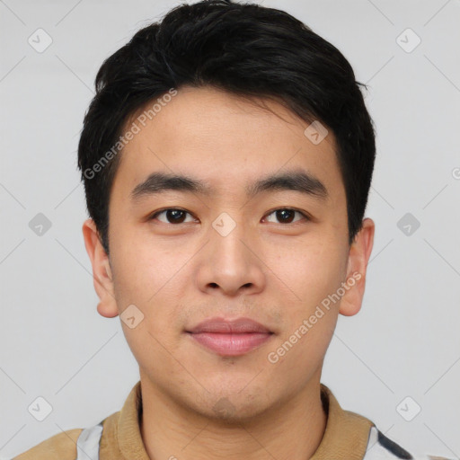 Joyful asian young-adult male with short  black hair and brown eyes