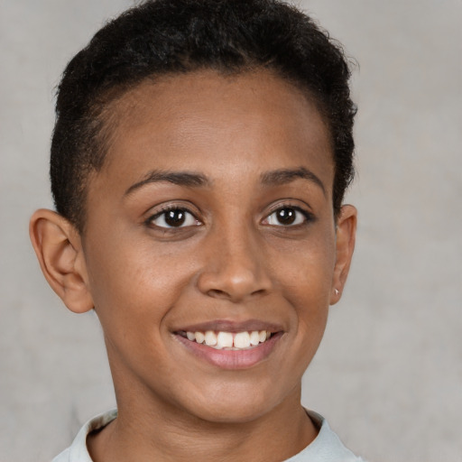 Joyful latino young-adult female with short  brown hair and brown eyes