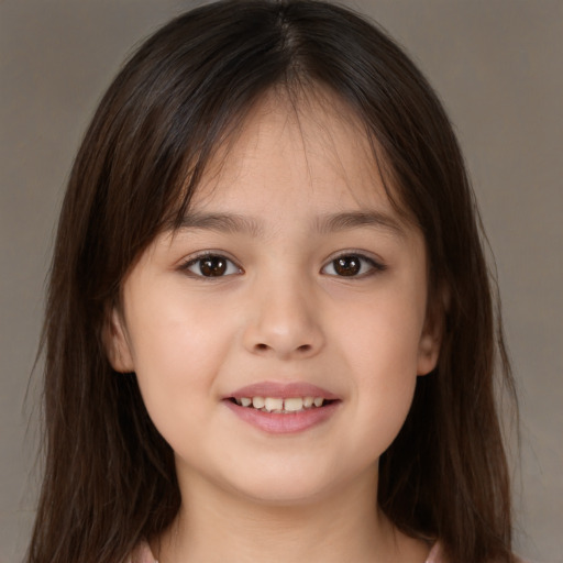 Joyful white child female with medium  brown hair and brown eyes