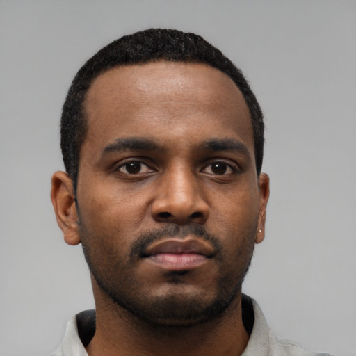 Neutral black young-adult male with short  black hair and brown eyes