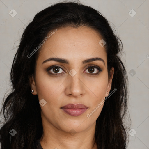 Joyful latino young-adult female with long  brown hair and brown eyes