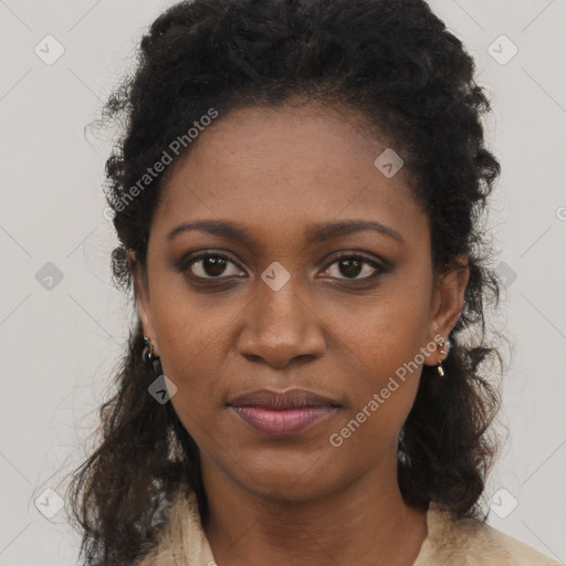 Joyful black young-adult female with medium  brown hair and brown eyes