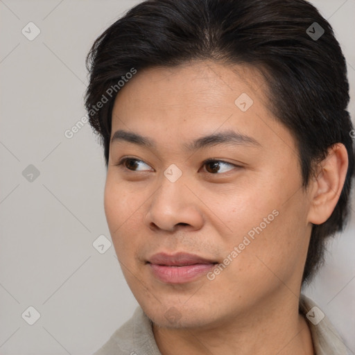 Joyful asian young-adult female with short  brown hair and brown eyes