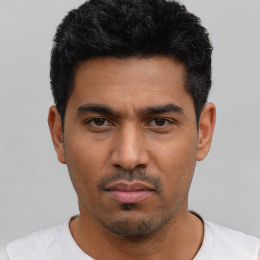 Neutral latino young-adult male with short  black hair and brown eyes